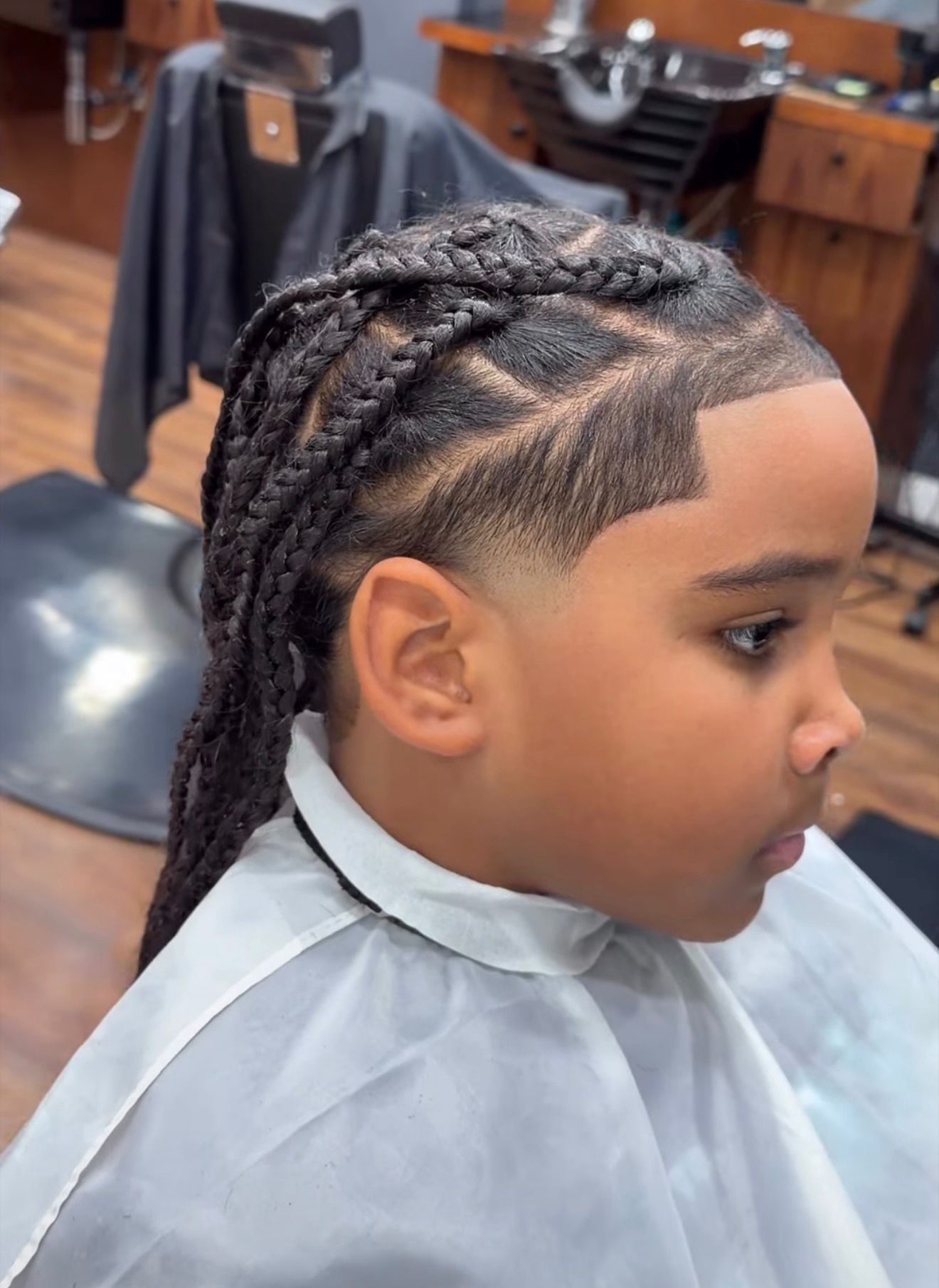 Front profile fade haircut by Alex Urbaez Barber