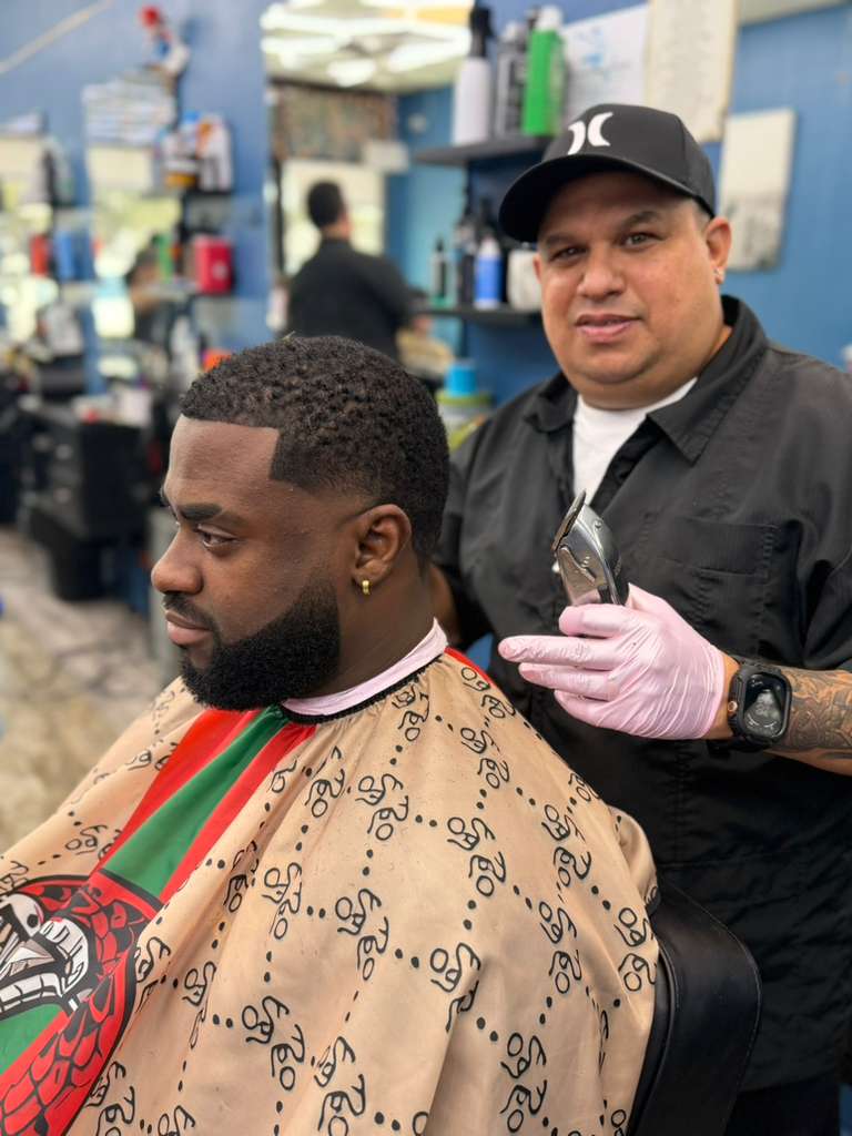Alex Urbaez working on a beard client in Gainesville FL